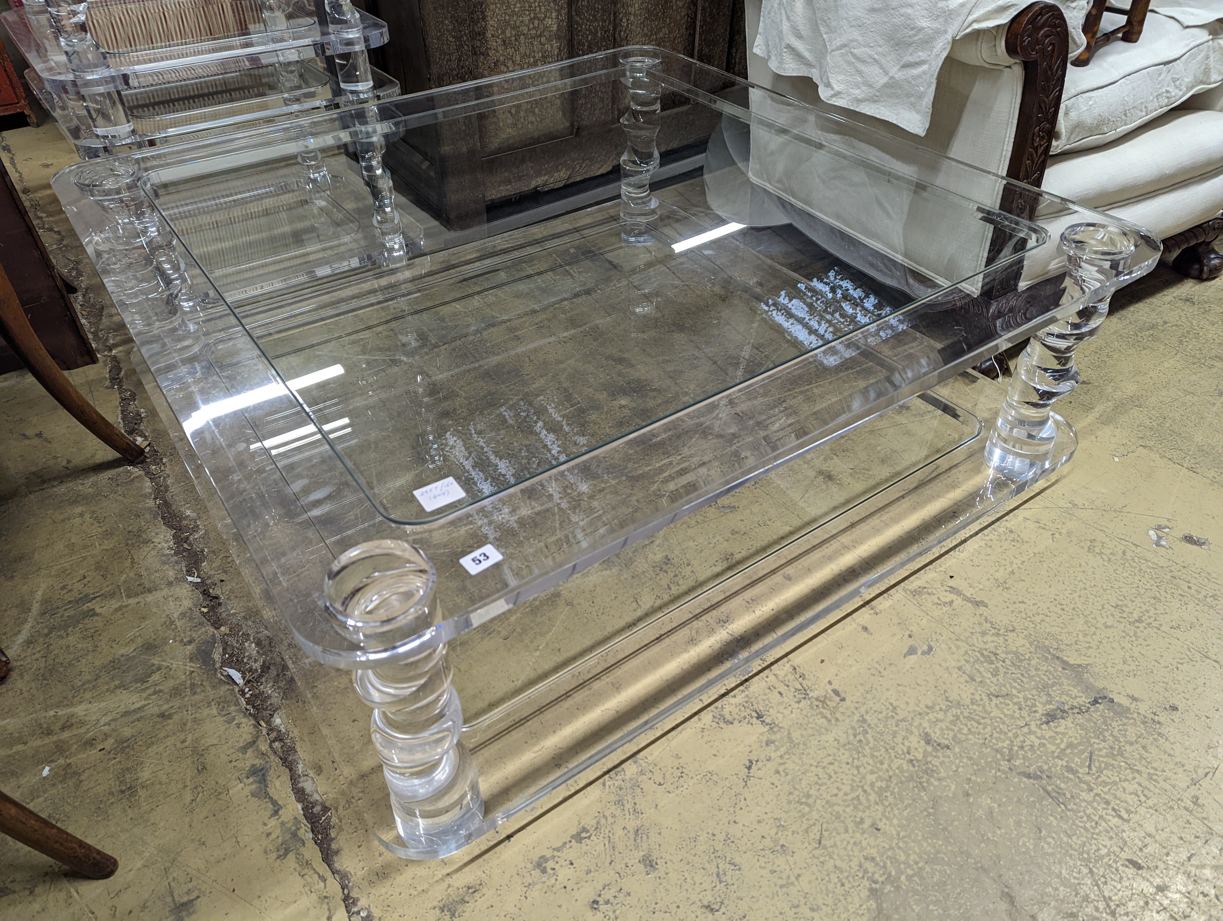 A contemporary square perspex and glass two tier coffee table, length 120cm, depth 40cm